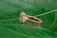 Baguette and Round Diamond Ring with Halo Frame Design