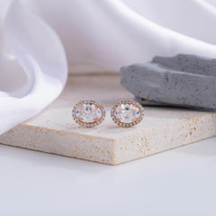 Elegant Oval-Cut Diamond Halo Stud Earrings in Rose Gold