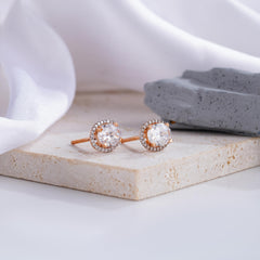 Elegant Oval-Cut Diamond Halo Stud Earrings in Rose Gold
