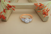 Elegant Rose Gold Diamond Three-Stone Ring
