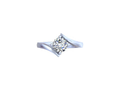 It looks like you have a beautiful rose gold engagement ring with a round, brilliant-cut diamond in a prong setting